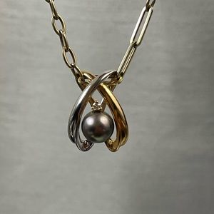 14 K white and yellow gold pendant with freshwater gray peal and diamond pendant
